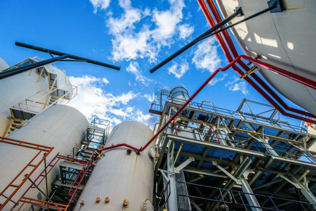 low-angle-view-of-storage-tanks-and-industrial-pip-2022-01-30-07-47-04-utc-1